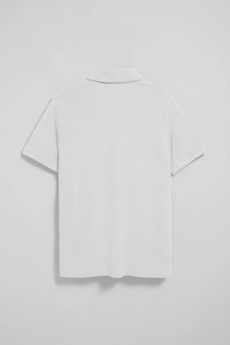 Polo blanco de manga corta y tres botones con logo bordado Rigby Go