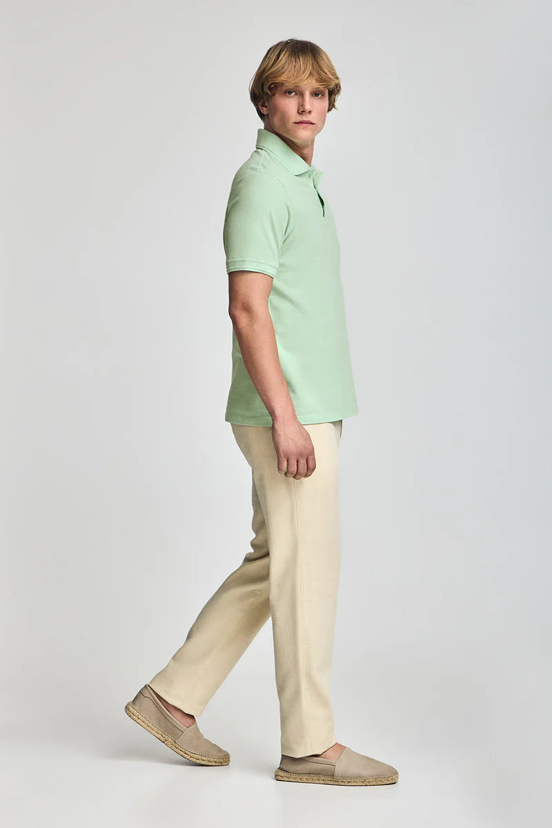 Polo verde menta de manga corta y tres botones con logo bordado Rigby Go